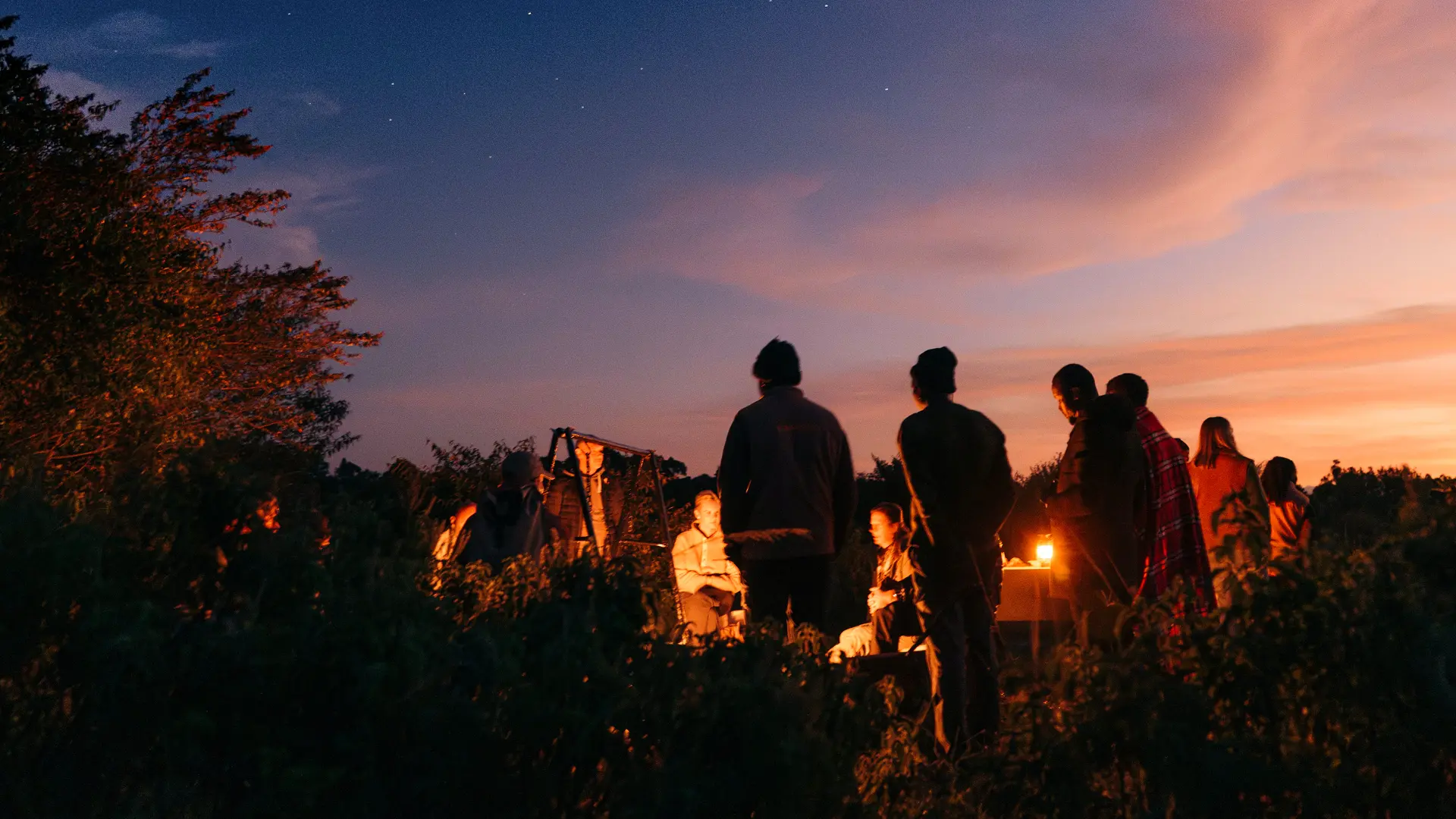 Emboo guests around the camp fire jpg